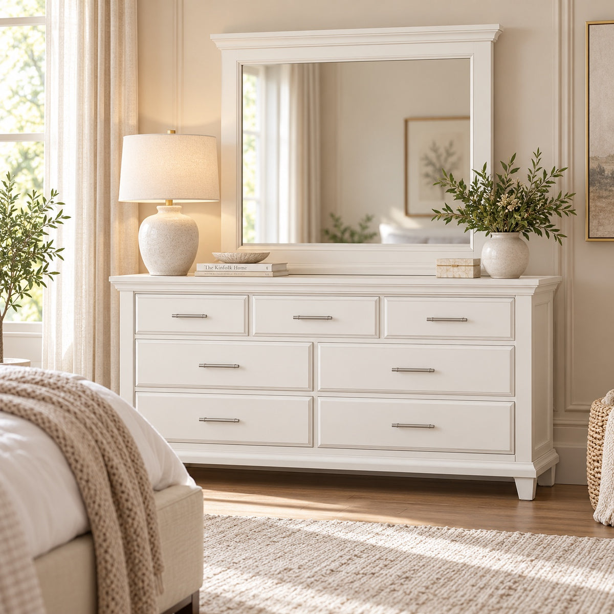 Bella Pearl white seven-drawer dresser and matching rectangular mirror styled in bright bedroom with silver hardware