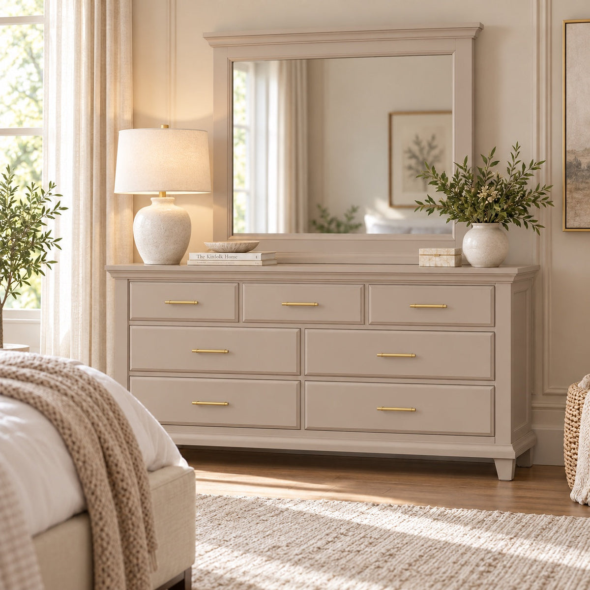 Dune Bella seven-drawer dresser and matching mirror with gold bar pulls styled in a softly lit neutral bedroom