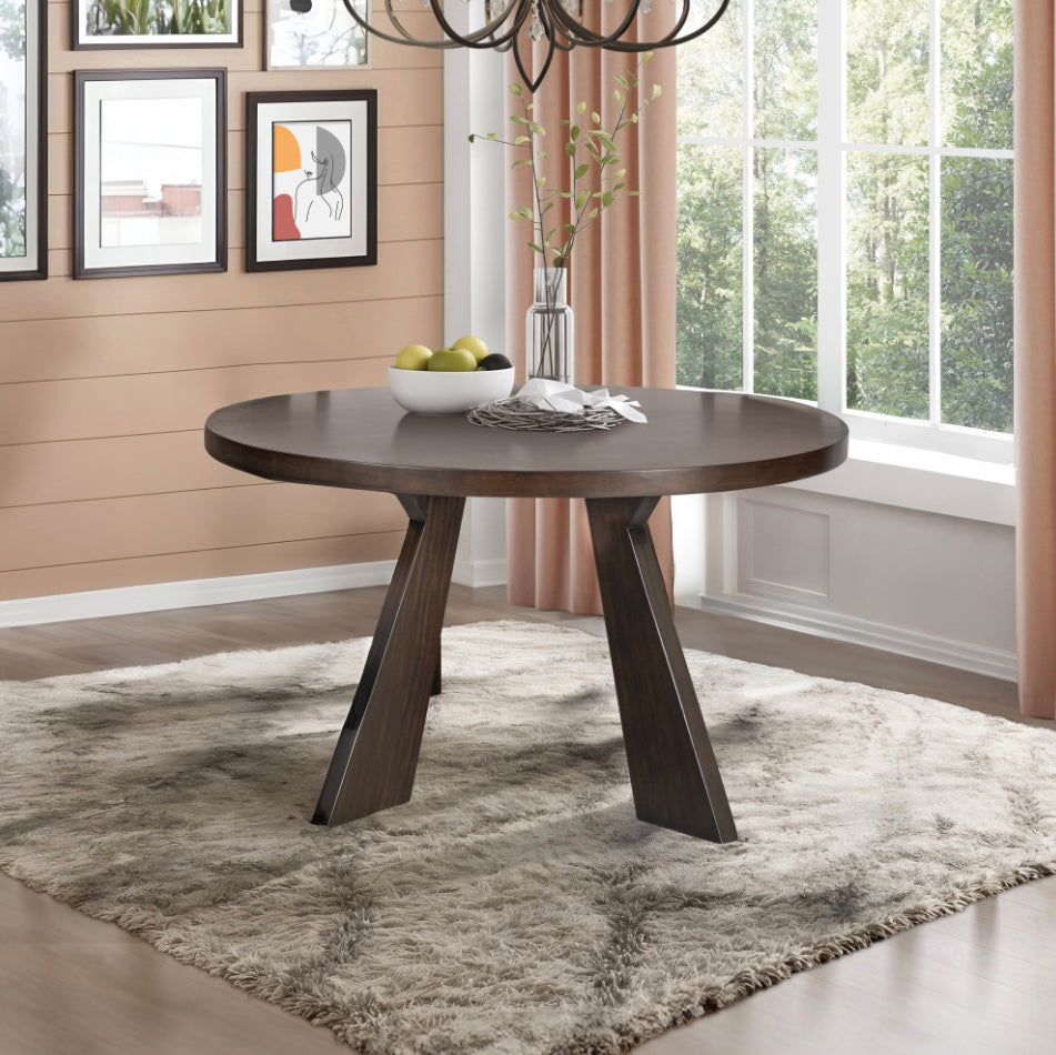 Chestnut Ridge 47 inch round dark brown dining table in a bright dining room