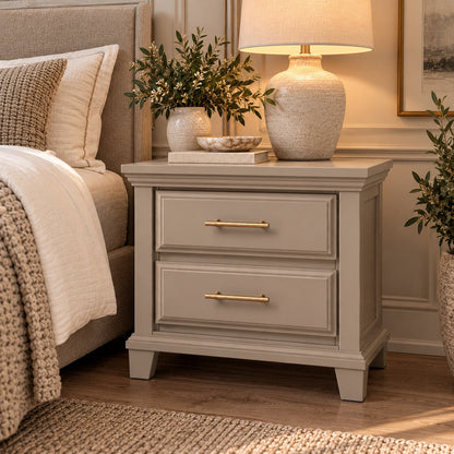 Bella Dune two-drawer nightstand styled beside a bed with a textured lamp, neutral decor and gold drawer pulls